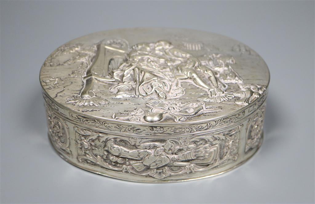 A late 19th/early 20th century German embossed 800 white metal oval box with hinged cover, 13.4cm,